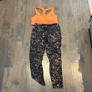 Fabletics Orange and Black leggings and orange sports bra no name